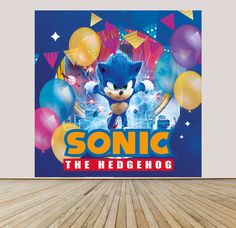 a sonic the hedgehog poster on a wall in an empty room with balloons and confetti