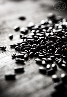 some seeds are laying on a wooden table