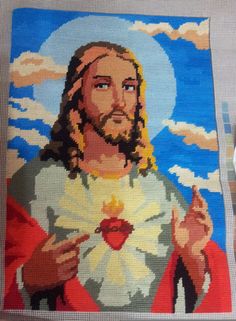 a painting of jesus holding a heart in his hands