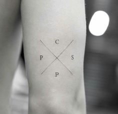 black and white photo of a person's leg with the letter p on it