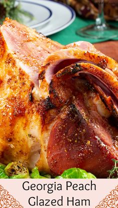 a close up of a turkey on a plate with the words georgia peach glazed ham