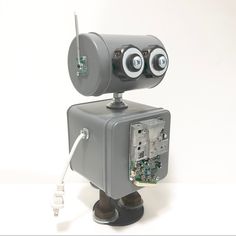 a robot made out of an old electrical box