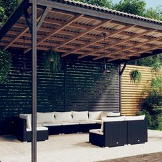 an outdoor living area with couches, tables and a pergolan roof over it