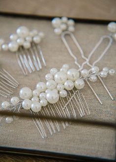 When it comes to this elegant Pearl Hair Comb Set, the styling possibilities are endless. Perfect for bridal showers, engagement parties, maternity photos, or prom up-dos, these pieces are poised to make you look simply exquisite. Each set comes with 5 pieces - one large pearl hair comb, 2 smaller pearl hair combs, and 2 pearl pins. Gold & Silver Finishes Available! Want to order multiple to give to your bridesmaids as gifts? Contact me about quantity discounts for your bridal party. Pearl Hair Pin, Pearl Hair Pin Wedding, Pearl Pins, Pearl Wedding Hair, Pearl Hair Piece, Pearl Hair Comb, Pearl Hair Combs, Comb Set, Veil Hairstyles