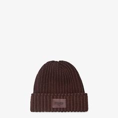 Beanie with turned-up brim. Made in a two-tone, dark purple wool jersey distinguished by a ribbed motif that recalls the iconic Selleria stitching. Embellished with a tone-on-tone Fendi Roma label in leather. Made in Italy. Size M_l Luxury Fitted Brown Hat, Luxury Brown Hat For Fall, Fitted Knitted Hat For Fall, Fitted Knitted Fall Hats, Classic Burgundy Hats For Winter, Classic Burgundy Winter Hat, Classic Burgundy Hats For Fall, Fitted Merino Wool Hats For Winter, Ribbed Fitted Hats For Fall