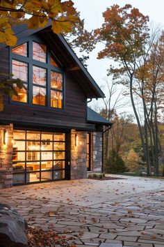 a large house with lots of windows and stone flooring