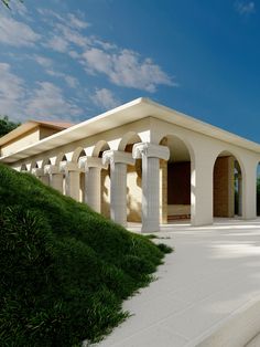 an artist's rendering of a white building with columns and grass on the side