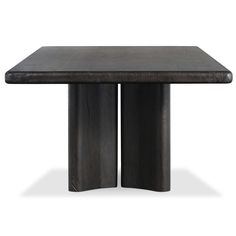 a wooden table with two black pillars on it