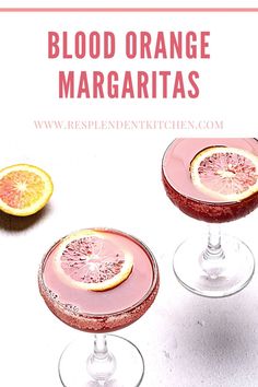 blood orange margaritas in coupe glasses with grapefruit garnish on the rim