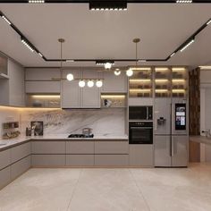 a modern kitchen with marble counter tops and stainless steel appliances, along with recessed lighting