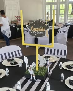 a table with black and white tables cloths