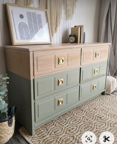 the dresser is painted green and has gold handles