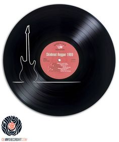 a black record with an electric guitar on it