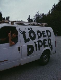 a white van with the words loaded diper painted on it