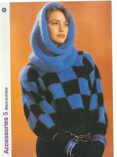 a woman wearing a blue and black checkered sweater with a hood on her head