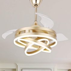 a ceiling light that is hanging from the ceiling in a room with white walls and flooring