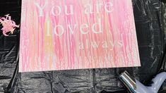 there is a sign that says you are loved alwayss on the wall next to a blow dryer