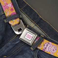 the belt is attached to the back of a pair of blue jeans with cartoon characters on it