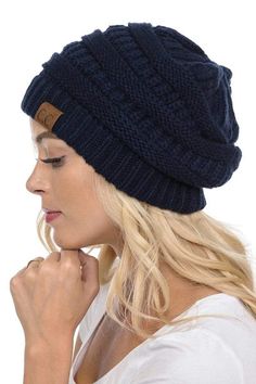 Out ultra-comfy CC hats come in a variety of colors. Style: Knit Beanie Material: 100% Acrylic Size: One Size Fits Most Measurements: 22-3/8" (57 cm.), Size 7-1/8 | Flat measurements: 11" x 9" An oversized slouchy cable knit beanie with ridges and a cuffed detail. Available in an array of solid colors. Black hat does NOT come with pom pom Warm Solid Color Crochet Hat, Warm Comfortable Beanie Hat, Comfortable One Size Fits Most Hat, Lightweight Comfortable Hat One Size Fits Most, Warm Slouchy Solid Color Hat, One Size Solid Color Hat For Fall, Comfortable Lightweight Hat, Warm Solid Hat, One Size Fits Most, Warm Hats For Cold Weather