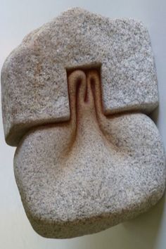 a stone sculpture with a curved section in the middle