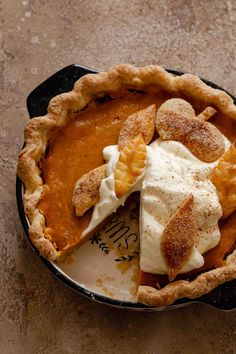 a pie with some whipped cream on top