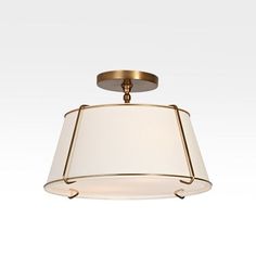 a light fixture with a white shade on it