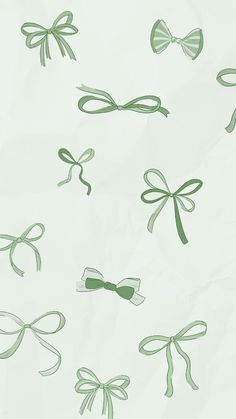 green bows and ribbons on white paper