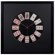 a clock with playing cards on the face and hands in black frame, showing four of spades