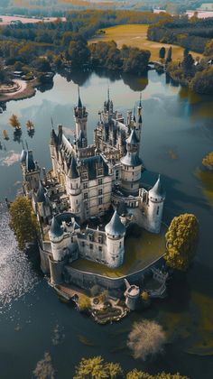 an aerial view of a castle in the water