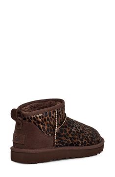 An ultrashort shaft adds a twist to this abbreviated version of a classic UGG boot—this time in cheetah-print genuine calf hair. The style delivers extra comfort with a lining from UGGplush, a moisture-wicking textile made from a wool-rich blend but crafted to feel and wear like genuine shearling. 1 3/4" heel; 1" platform (size 11) 4" shaft Pull-on style Genuine calf-hair (Vietnam) and leather upper/UGGplush wool-blend lining/synthetic sole Imported Cheetah Print Uggs, Cute Uggs, Cute Vans, Ugg Classic Ultra Mini, Classic Ugg Boots, Cute Online Clothing Stores, Pretty Shoes Sneakers, Shoes Outfit Fashion, Shoe Inspo