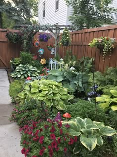 a garden filled with lots of different types of flowers