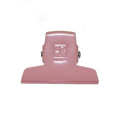 a pink plastic object on a white background