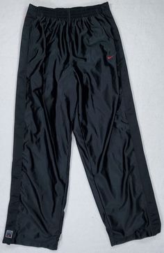 This listing is for the pictured VERY GENTLY pre-owned vintage Nike Men's Size XL Tear Away / Breakaway Snap Pants! Classic Black and Red colorway, all snaps functional. See ALL pics for measurements and details! Shipped FAST and FREE with USPS, which includes tracking. All orders will be shipped by the end of the business day following the day I receive payment, though I will make every effort to ship same-day! Nike Red Pants For Streetwear, Nike Parachute Pants Vintage, Y2k Nike Track Pants Men, Baggy Nike Track Pants Men, Nike Retro Track Pants, Nike Blue Vintage Track Pants, Basketball Pants, Snap Pants, Timberland Outfits