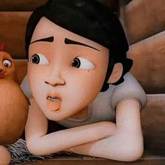 a cartoon character laying on the ground next to an orange and a small bird in front of him