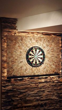 a stone wall with a dart in the center and darts on it's side