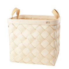 a large woven basket with handles on the front and sides, in natural color leather