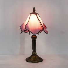 Vintage Rose Petal Tiffany-Style Glass Table Lamp - Pink Flower Design, Elegant Bedroom Decor, Perfect Gift for Her  Add a touch of timeless elegance to your space with this exquisite rose-petal-inspired table lamp. Crafted with a classic Tiffany-style stained glass shade in delicate pink hues, this lamp radiates a warm and inviting glow, making it a stunning centerpiece for bedrooms, living rooms, or reading spaces. ✨ Features: Tiffany-Style Craftsmanship: The stained glass shade features petal-like shapes in soft pink tones for a romantic and vintage appeal 💕 Durable Polymer Resin Base: Designed to resemble antique bronze, the sturdy base combines lightweight practicality with classic charm 🏛️ Soft Ambient Lighting: Creates a cozy atmosphere, perfect for bedtime reading or as mood ligh Green Desk Setup, Cottage Core Desk, Cottagecore Garden, Pink Flower Design, Elegant Bedroom Decor, Lamp Pink, Desk Room, Lamp Large, Easy Room Decor