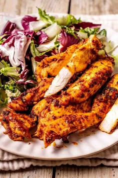 grilled chicken and salad on a white plate