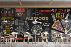 a restaurant with chalkboard wall mural and wooden chairs in front of the blackboard that has pizza festoon written on it