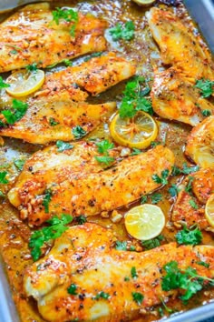 chicken with lemons and parsley in a casserole dish, ready to be eaten