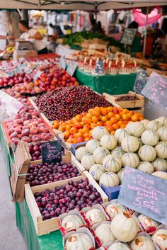 various fruits and vegetables are on display for sale