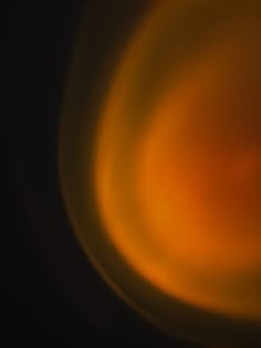 blurry image of an orange object in the dark