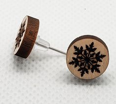 These little snowflake stud earrings are the perfect gift for the winter lover in your life. These cute wood earrings are lightweight and versatile enough to add a nice touch to any outfit. Details... one set of earrings Basswood  laser cut  stud earrings  .5 inches in diameter sterling silver posts rubber back Free gift wrapping upon request. This set is handmade. Because of this, there may be slight variances from included photos. Do not submerge in water (showering, swimming, etc.). These are Glowforge Jewelry, Laser Studio, Snow Earrings, Wood Laser Ideas, Wood Jewelery, Laser Cut Wood Earrings, Wood Earrings Stud, Winter Schnee, Laser Ideas