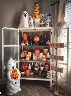 a shelf filled with lots of halloween decorations