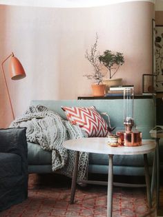 a living room with two couches and a coffee table in the middle of it