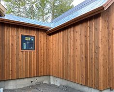 two wooden buildings sitting next to each other