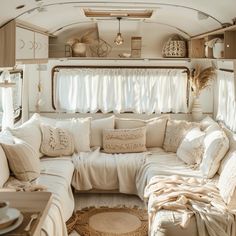 a living room filled with lots of furniture and pillows on top of it's walls