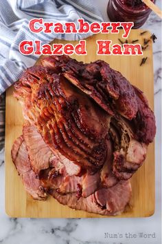 baked ham with cranberry glaze on a cutting board