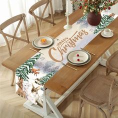 a wooden table topped with plates and cups