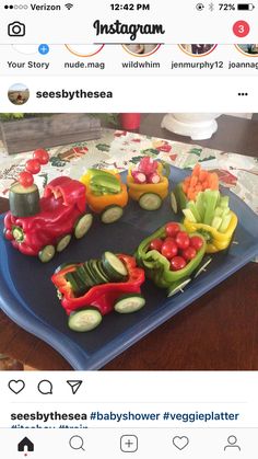 some veggies are arranged on a blue platter with the word instagram